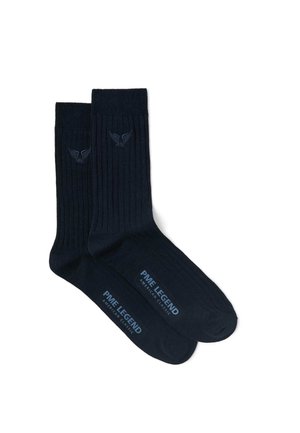 Paire de chaussettes côtelées noires avec le logo PME Legend American Classic sur le pied et un emblème ailé près du haut du bord-côte.