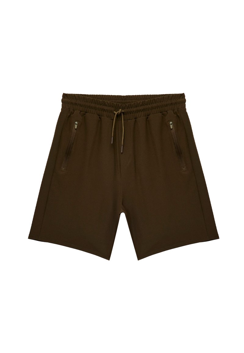 Bruine sportshorts van gladde stof. Voorzien van een elastische tailleband, trekkoord en twee ritszakken aan de zijkanten.