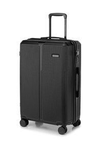 Black hard-shell suitcase with vertical ribbed texture, extendable handle, top and side grips, four wheels for mobility, and combination lock.