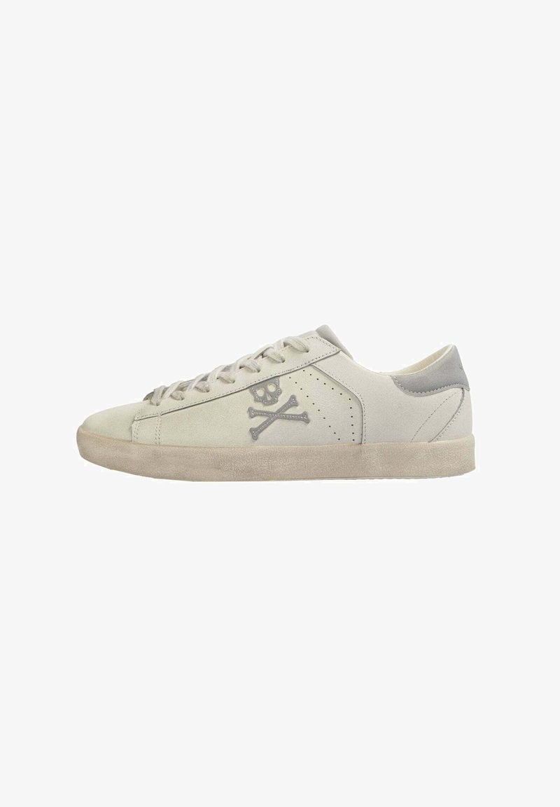Light gray suede sneakers with a textured finish, featuring a skull and crossbones design, round toe, flat sole, and beige accents.