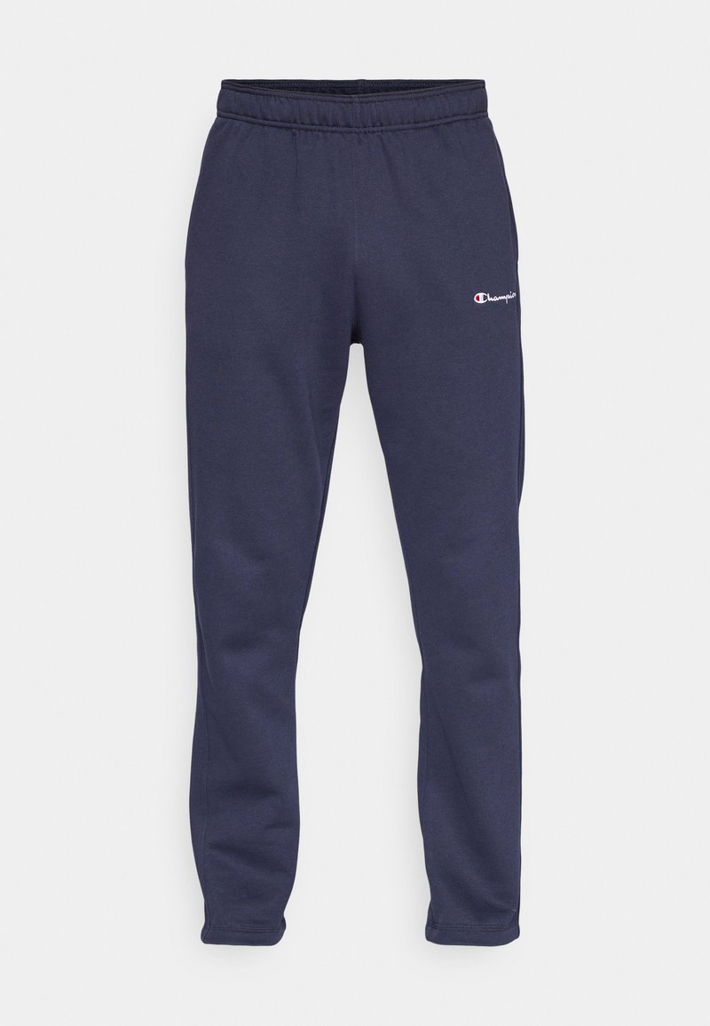 Pantalons de survêtement bleu marine avec une taille élastique, des poignets froncés et un petit logo brodé sur la cuisse gauche. Fabriqués en tissu doux.