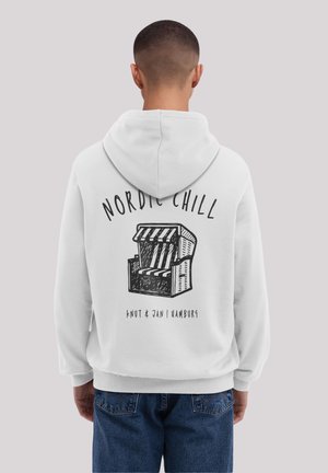White hoodie featuring a graphic of a beach chair with stripes, text "NORDIC CHILL," and "KNUT & JAN | HAMBURG" below. Adjusted fit and texture.
