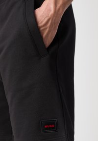 HUGO Pantalon de survêtement - black