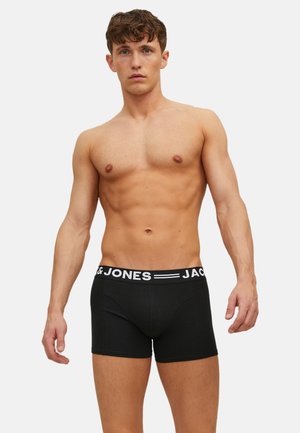 Sorte boxershorts lavet af bomuld, med en hvid elastik i taljen med synligt logo. Designet er tætsiddende med en glat tekstur.