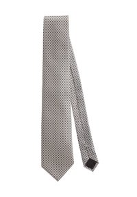 Gray tie with a repeated circular pattern, made of smooth fabric; narrow, with a pointed end and a black accent on the back.