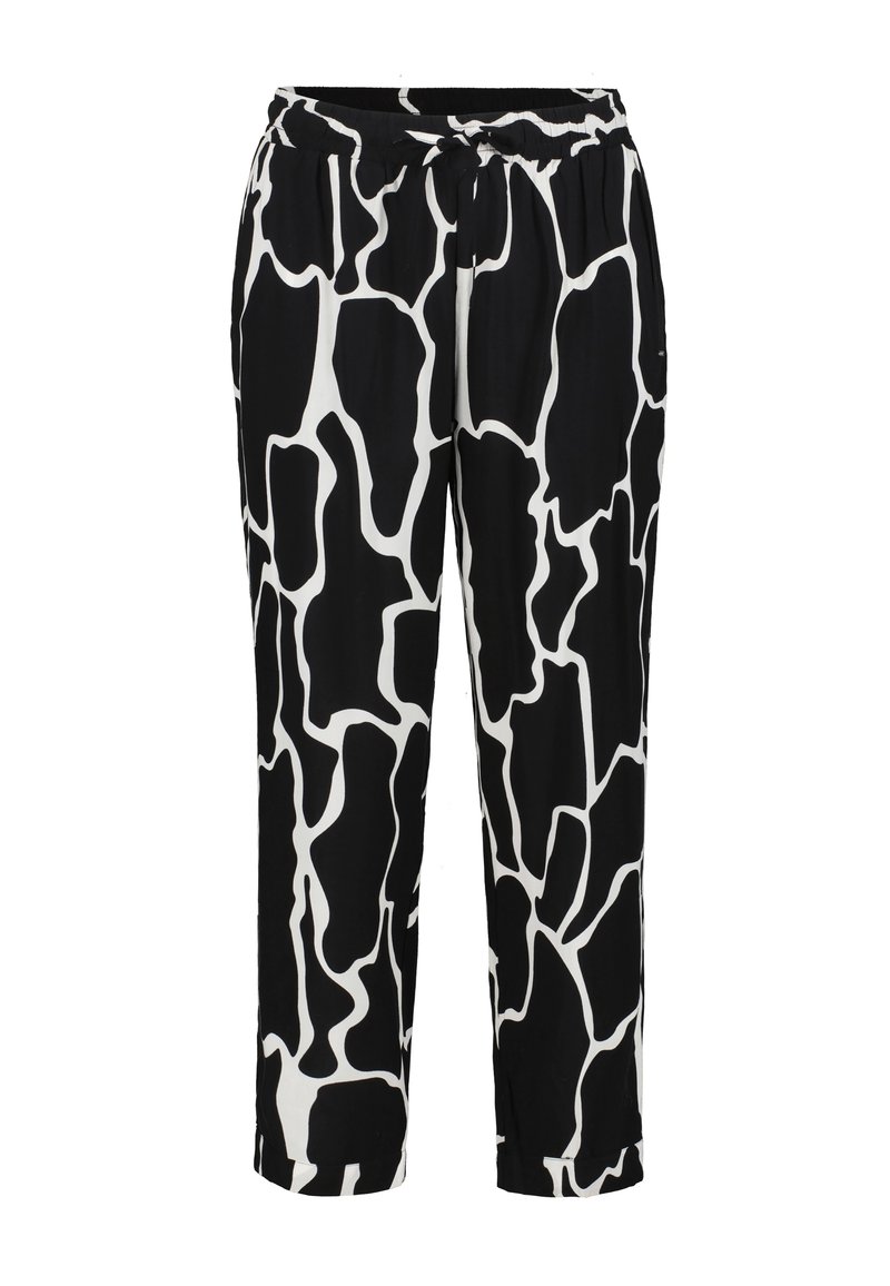Pantalons à motifs noir et blanc avec un design imprimé de girafe, taille élastique et coupe décontractée avec des ourlets courts. Texture de tissu douce.