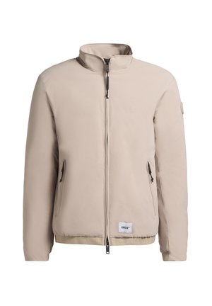 Béžová bunda s vysokým golierom, dvoma prednými vreckami na zips a značkovým lemom. Hladká, štruktúrovaná tkanina s minimalistickým dizajnom.