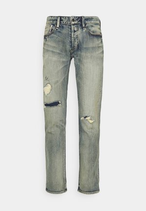 Abgenutzte hellblaue Jeans aus Denim mit abgenutzten Stellen und Rissen an beiden Beinen, klassischer Fünf-Taschen-Stil, gerade Beinform.
