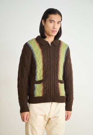 Brown knitted cardigan with a collared neckline. Features green, blue, and red accent patterns, two front pockets, and textured cable-knit design.