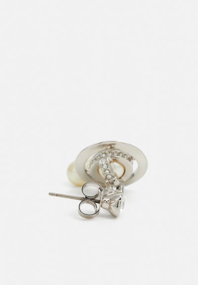 Silver brooch with a circular design featuring a pearl and rhinestones, shaped like intertwined elements with a pin backing for attachment.