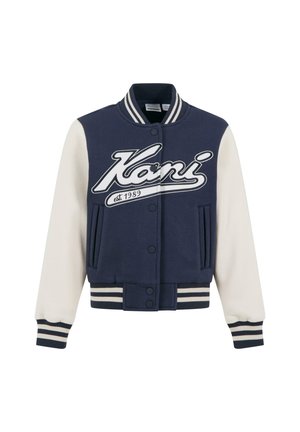 Giacca varsity blu navy con maniche bianche, polsini e bordo a coste. Presenta un grande logo bianco e l'anno di fondazione stampato. Tasche frontali.