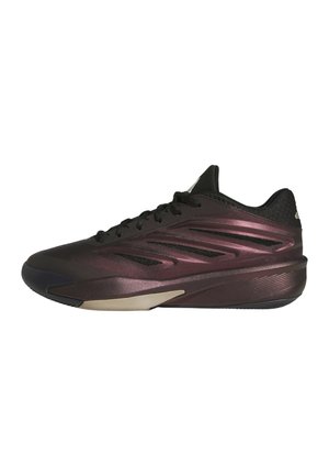 Low-top atletiksko i mørk metallic lilla med sorte snørebånd, sort krave og tekstureret sål, vist fra siden på hvid baggrund.