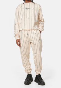 Karl Kani Träningsbyxor - beige
