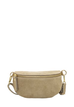 Sac en croûte de cuir beige, de forme arrondie, avec une fermeture éclair dorée et une sangle amovible. Présente un petit détail de tirette de zip.