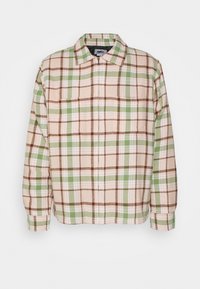 Checkered jacket featuring a mix of brown, green, and beige hues. Made of soft fabric with a collar and zip closure.