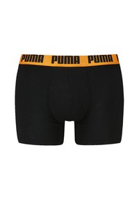 Schwarze Boxerbriefs mit glatter Textur und einem elastischen Bund, der das Puma-Logo in Schwarz auf einem orangefarbenen Hintergrund zeigt.