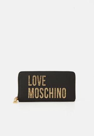 Black zip-around wallet with large textured gold letters spelling "LOVE MOSCHINO" on front and gold zipper pull.