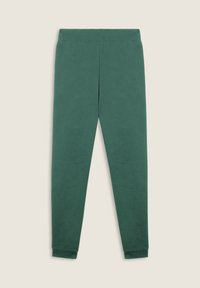 Joggers verdi in cotone con una texture liscia, vestibilità affusolata, vita elastica e polsini a coste. Nessun motivo o accessorio visibile.
