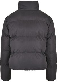 Veste d'hiver matelassée noire avec col montant, manches longues et coutures horizontales, vue de dos.