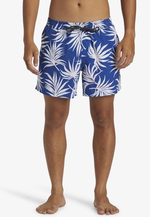 Blauwe zwemshorts met een wit tropisch bladerenpatroon, elastische tailleband en verstelbaar trekkoord. Lichtgewicht stof en middellange lengte tot de bovenbenen.