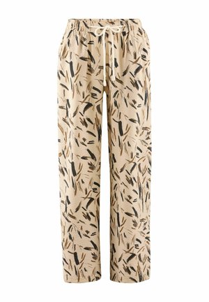 Beige, löst sittande byxor med elastisk midja och dragsnöre. Har ett svart och brunt abstrakt mönster över hela tyget.