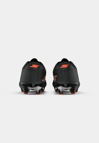 Black soccer cleats with a smooth texture, featuring bright orange accents and a molded black sole with spikes for traction.