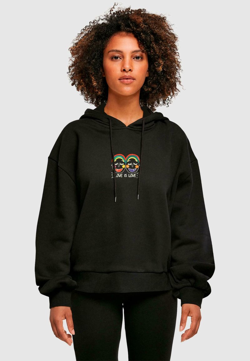 Black hoodie with a relaxed fit, featuring a colorful graphic of two faces and the text "Love Is Love" at the center, drawstring hood.