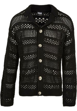 Schwarze Strickjacke mit einem gestrickten, durchbrochenen Design. Verfügt über einen Kragen, lange Ärmel und sechs große, runde Knöpfe auf der Vorderseite.