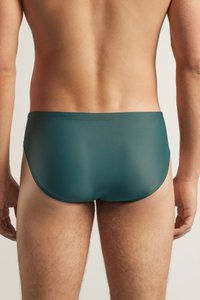 Türkise Schwimmbriefe aus glattem, elastischem Material. Entworfen für eine enge Passform, mit einem tief sitzenden Bund und minimalen Nähten.