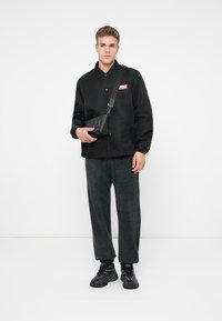 Diesel MARKY CUFF - Jogginghose - black