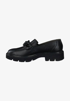 Mocassin en cuir noir avec semelle épaisse et détail décoratif en forme de nœud sur le dessus, vue de côté.