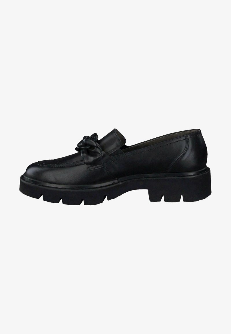 Mocassin en cuir noir avec semelle épaisse et détail décoratif en forme de nœud sur le dessus, vue de côté.