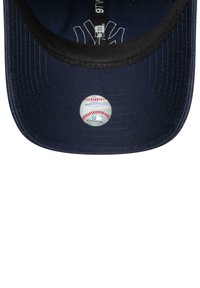 Navy baseball cap with a black brim, featuring a circular MLB hologram sticker on the front, highlighting the brand and authenticity.