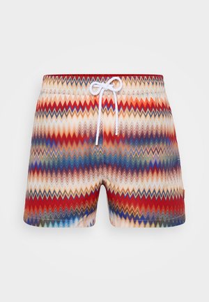 Badedraktshorts med et flerfarget sikksakkmønster i rød, blå og beige; har hvit snøring og elastisk midjebånd.