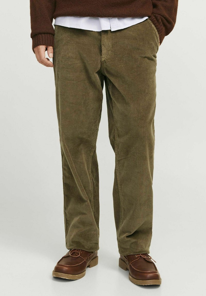 Olive green corduroy pants with vertical ribbing, straight leg design, and side pockets, paired with brown leather shoes.