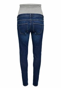 Karcsú farmernadrág sötétkék denim anyagból, szürke rugalmas derékpánttal és két hátsó zsebbel. Simaképű, testhezálló kialakítás.