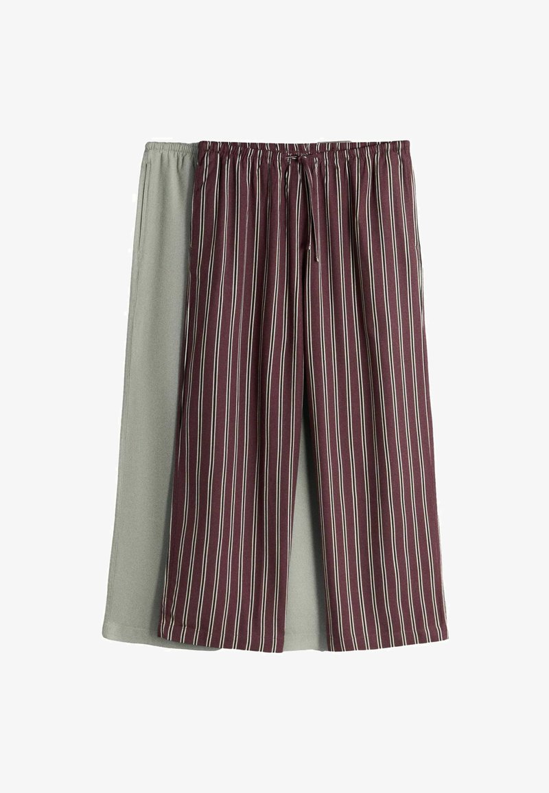 Two pairs of loose pajama pants, one solid light gray, the other burgundy with thin white vertical stripes, both with elastic waistbands.