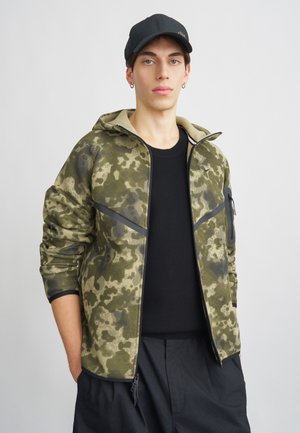 Jaka ar rāvējslēdzēju - neutral olive/black