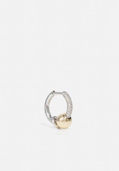 Gold and silver hoop earring featuring a smooth gold ball, a curved silver section set with small clear stones, and polished finishes.