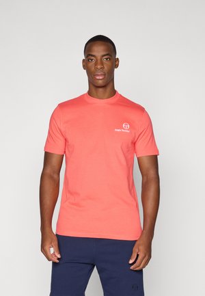 Coral cotton t-shirt with short sleeves, crew neck, and small logo on the left chest. Smooth texture, fitted design.