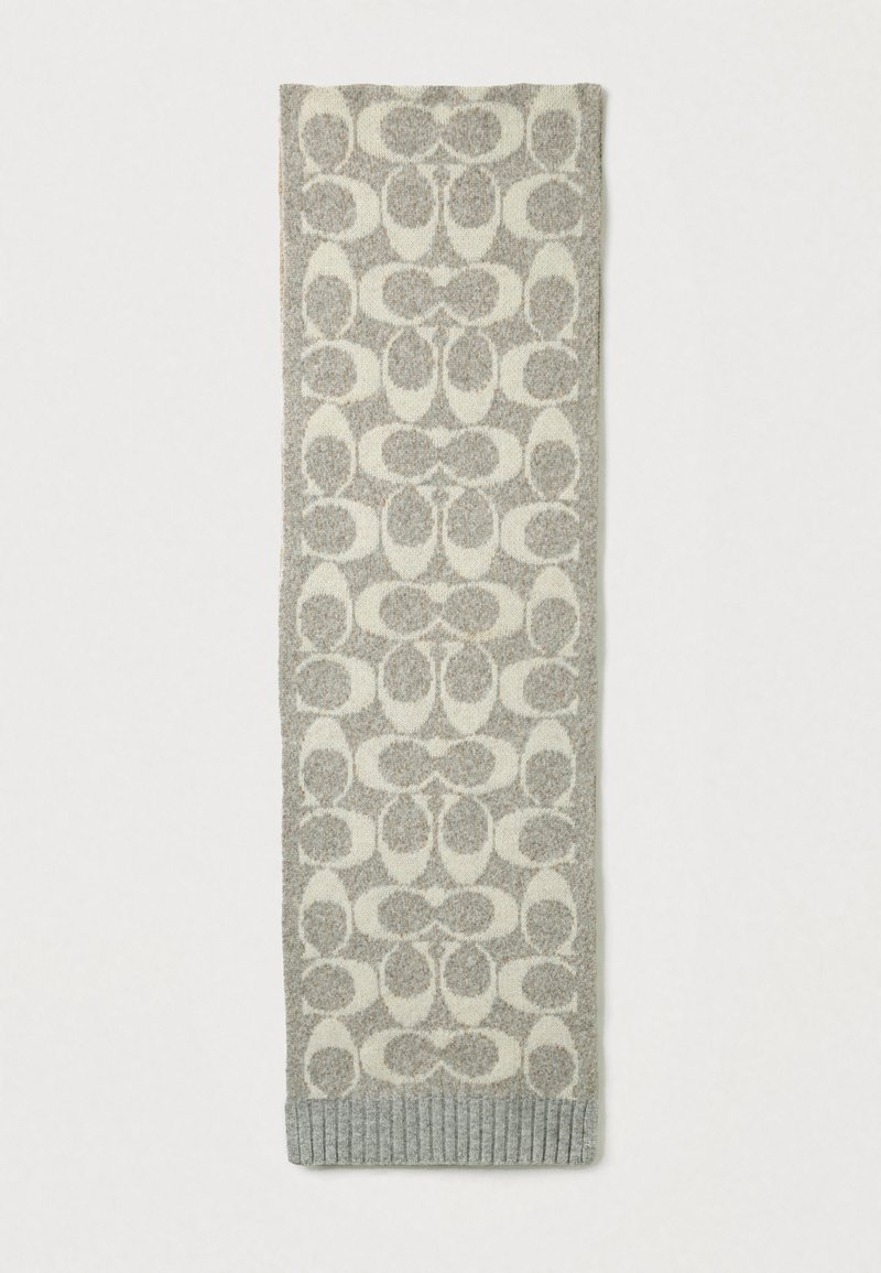 Pletený šál s opakujúcim sa vzorom prekrývajúcich sa tvarov v svetlo sivej a krémovej farbe, s rebrovaným šedým spodným okrajom.