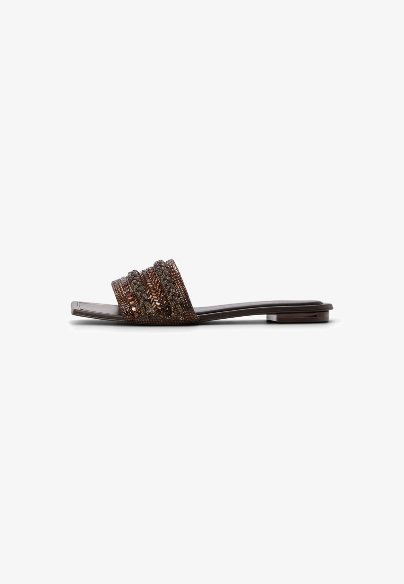 Flat brown slide sandal with beaded and textured wide strap and low square heel on white background.