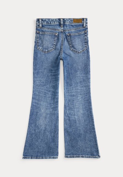 Flared blue jeans made of denim, featuring four pockets, a leather tag on the waistband, and light whiskering detail on the fabric.
