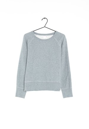 Lysegrå langærmet sweatshirt med rund hals på en sort bøjle mod en hvid baggrund.
