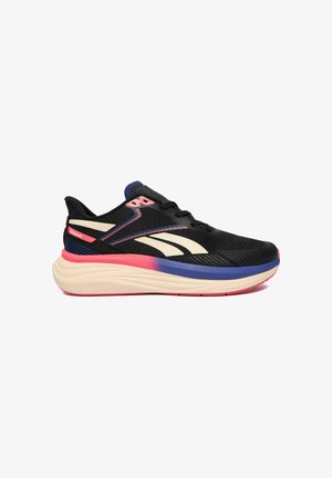 Zapatilla de running negra de Reebok con logo en color crema, detalles en rosa y azul, suela acolchada y cierre con cordones mostrada en perfil lateral.
