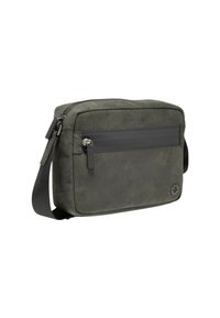 Borsa a tracolla verde oliva realizzata in tessuto testurizzato. Presenta una tasca frontale con zip, tracolla regolabile e un accento con logo su un lato.