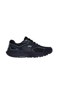 Schwarzer Sportschuh mit strukturiertem Mesh-Obermaterial, geschwungenem Design und reflektierenden Akzenten. Mit einer dicken Gummisohle für Dämpfung.