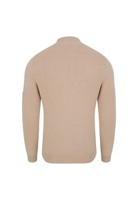 Beżowy sweter z dzianiny z wysokim kołnierzem, długimi rękawami i ściągaczem u dołu. Posiada kieszonkę na lewym rękawie.