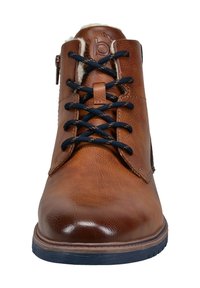 Brauner Leder-Stiefelette mit glatter Oberfläche, navyblauen Schnürsenkeln, seitlichem Reißverschluss und einem mit Fell gefütterten Kragen. Verfügt über eine profilierte Gummisohle.