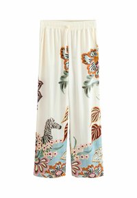Loose-fitting, cream-colored pants with a floral and zebra pattern. Features an elastic waistband and wide legs. Lightweight fabric.